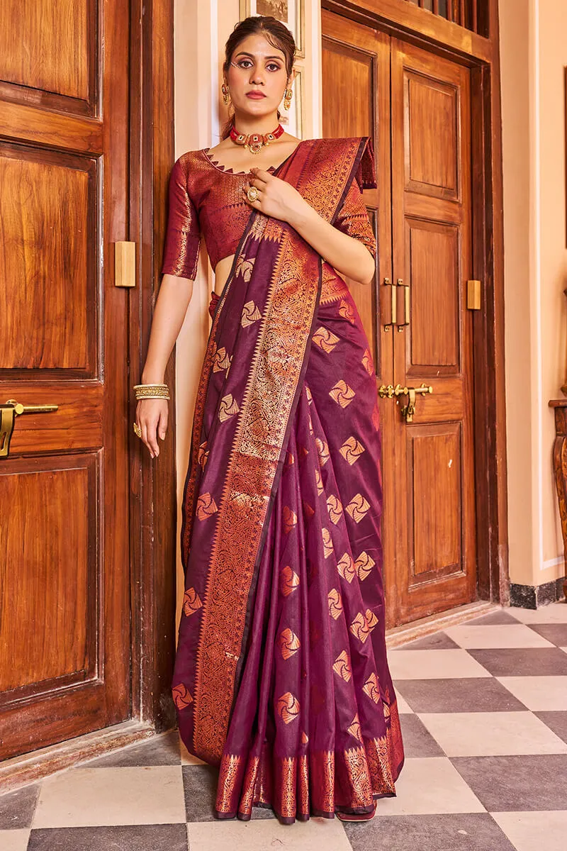 Cynosure Purple Soft Banarasi Silk Saree With Brood Blouse Piece