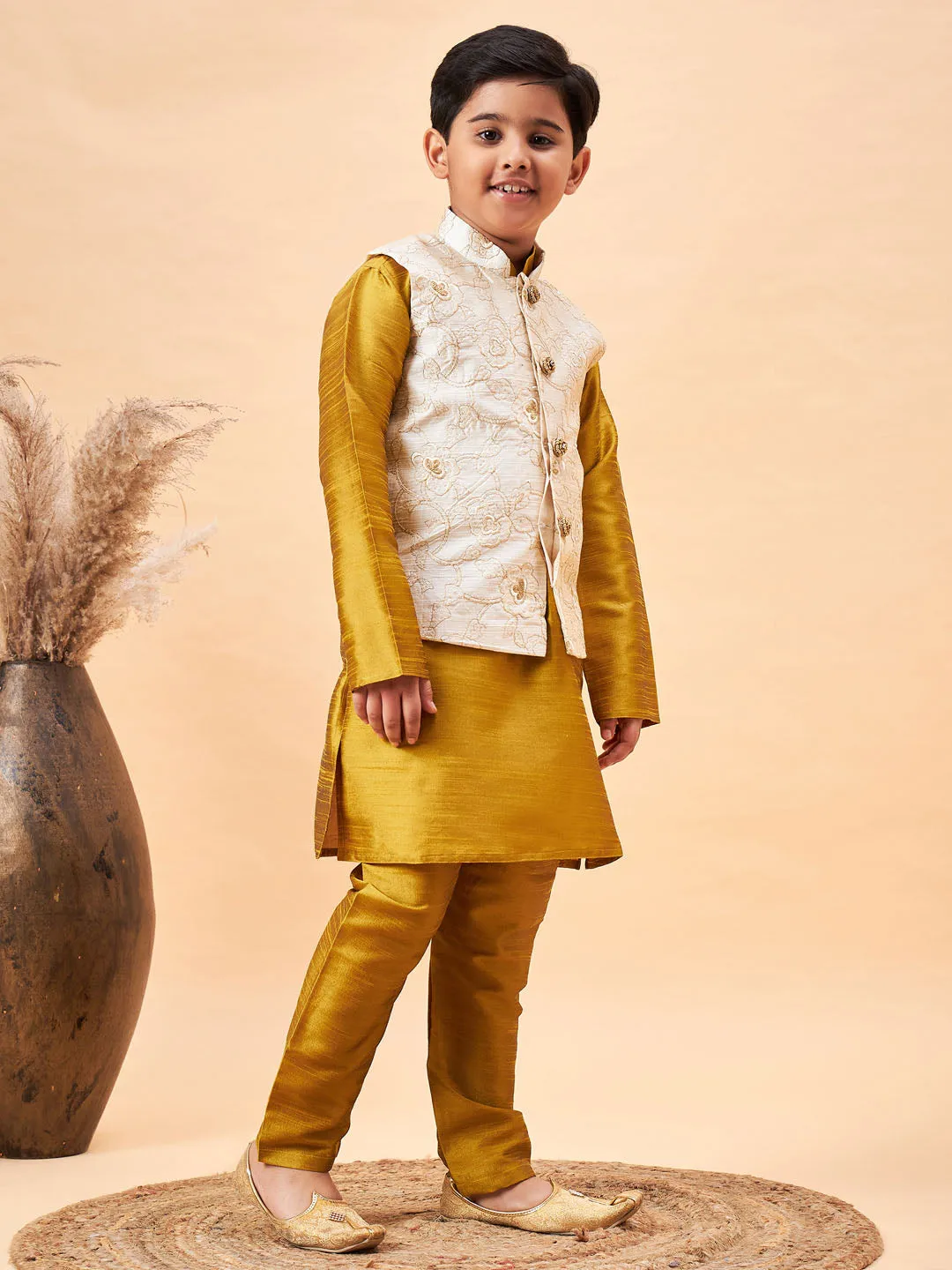 Vastramay Boy's Beige Nehru Jacket With Mustard Kurta And Pyjama Set