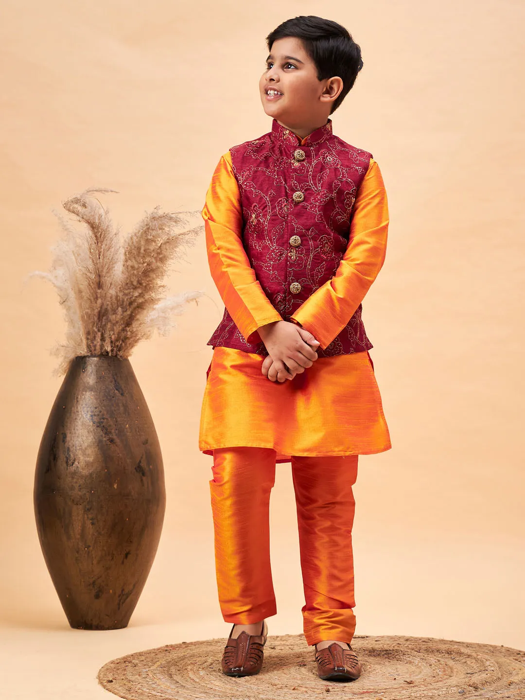 VASTRAMAY Boy's Maroon Nehru Jacket With Orange Kurta And Pyjama Set